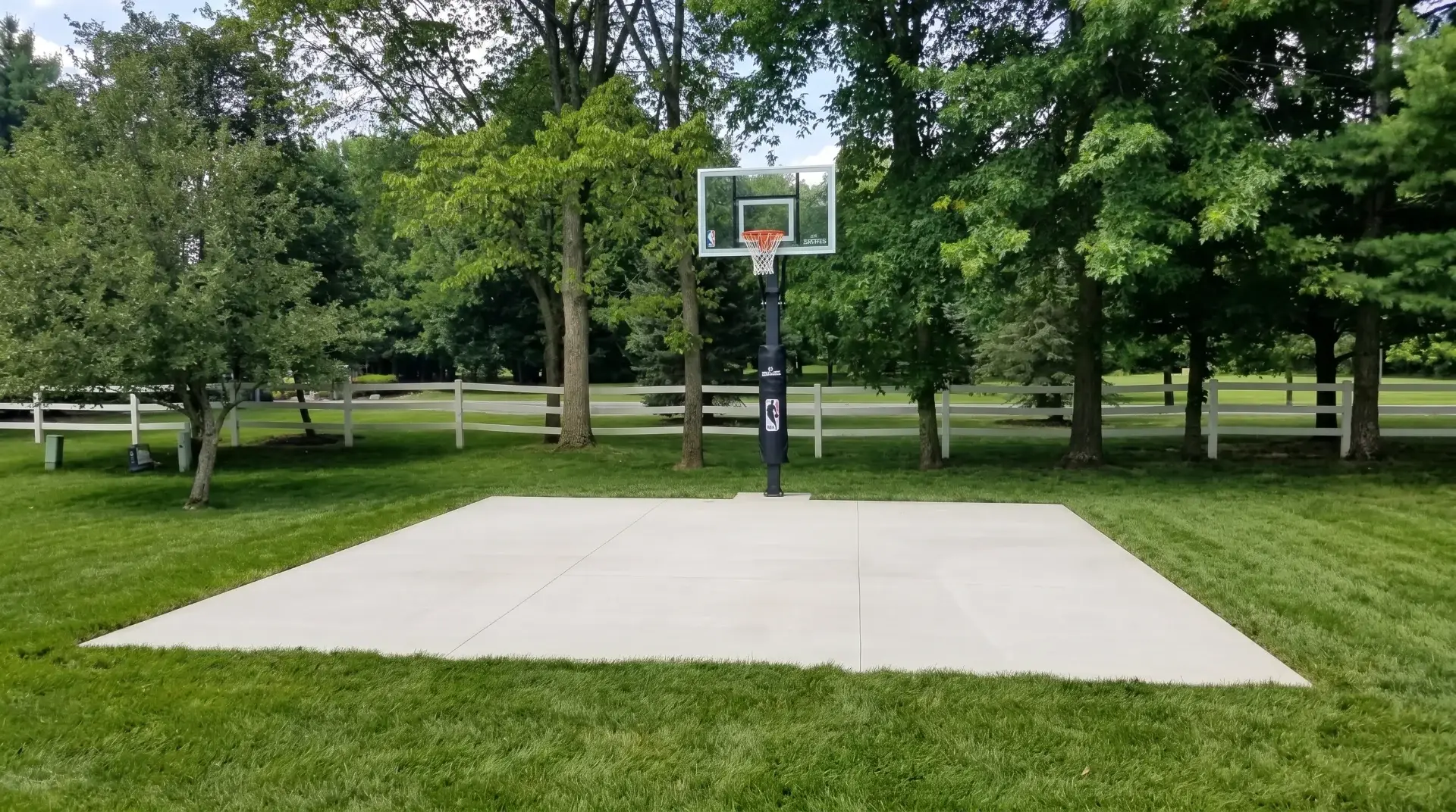 Custom concrete driveway and outdoor living space by Maxima Concrete in Ohio