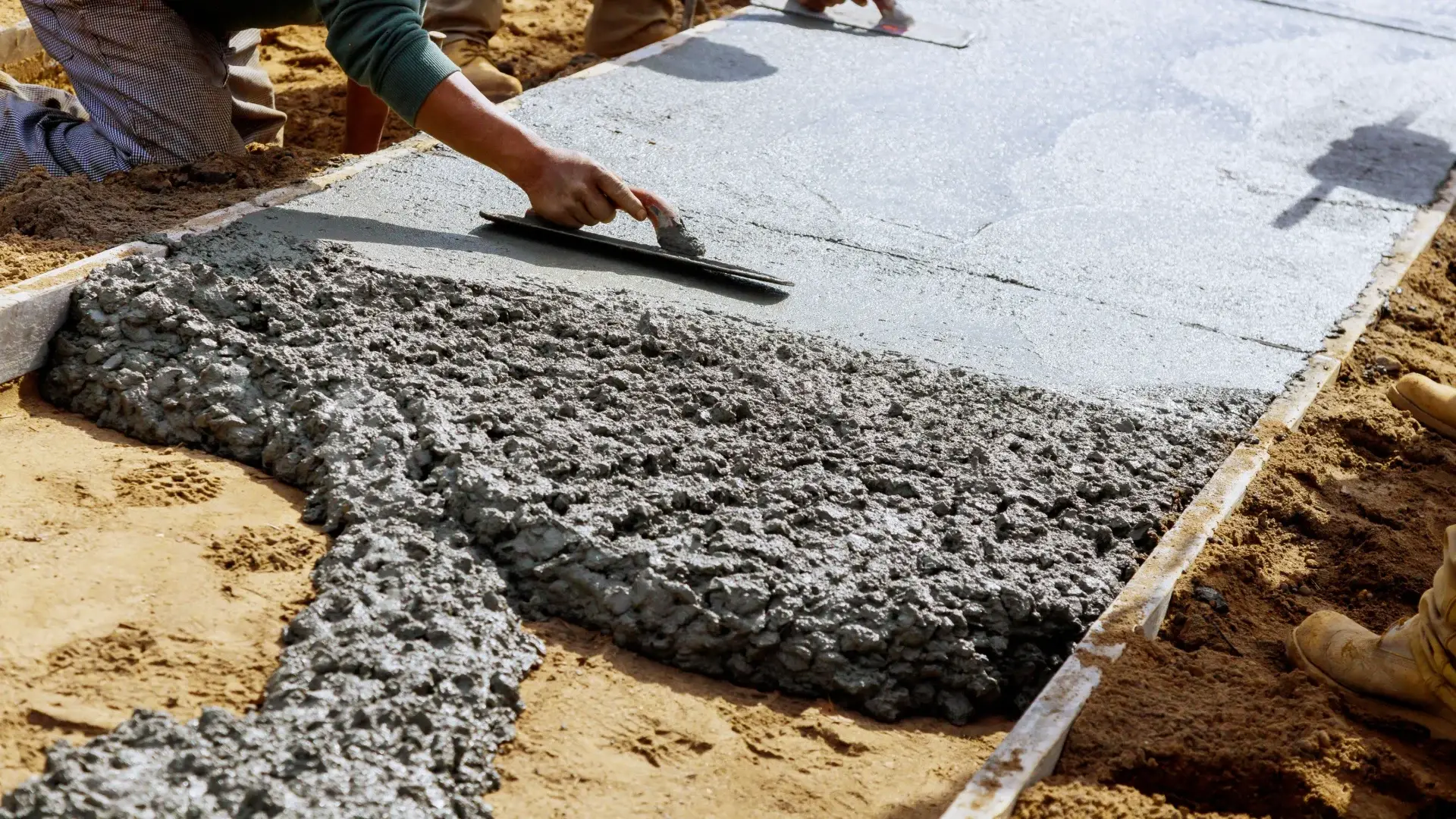 Custom concrete driveway and outdoor living space by Maxima Concrete in Ohio