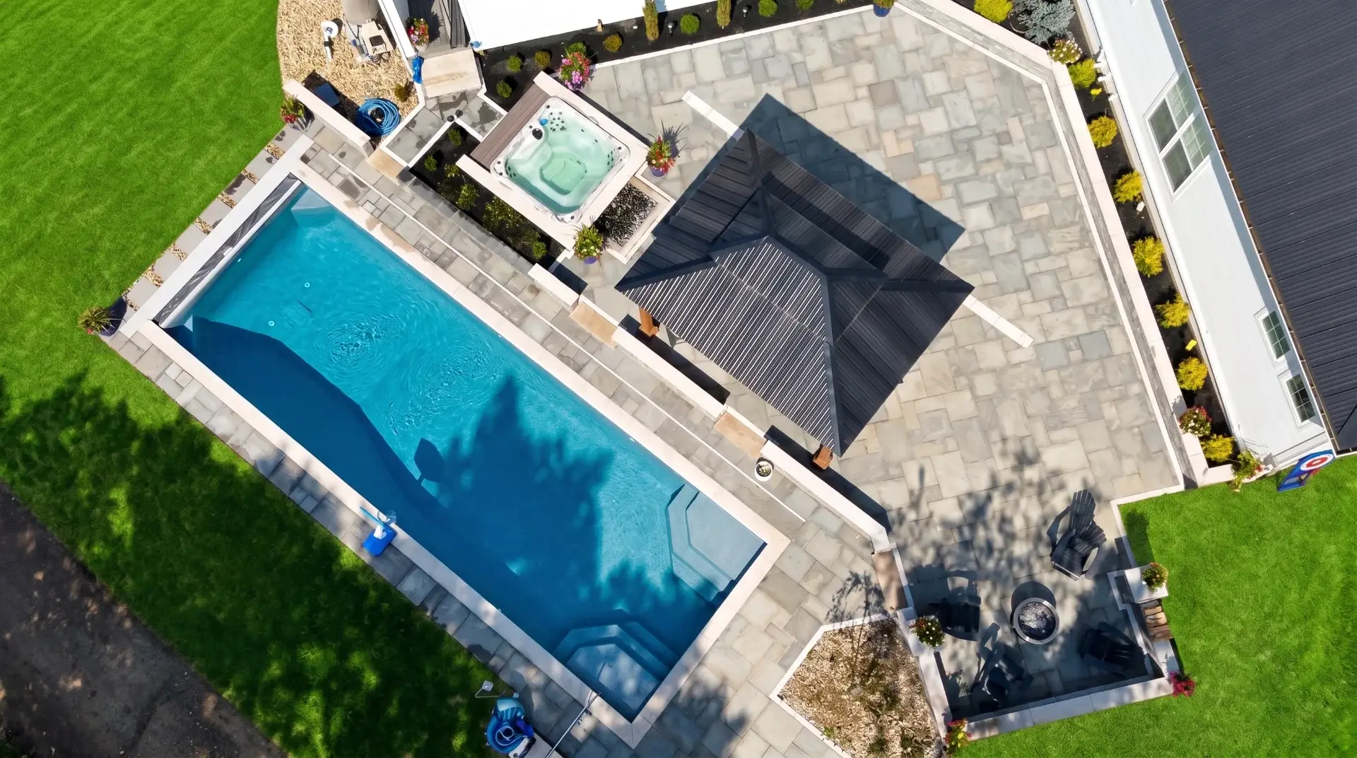 Custom concrete driveway and outdoor living space by Maxima Concrete in Ohio
