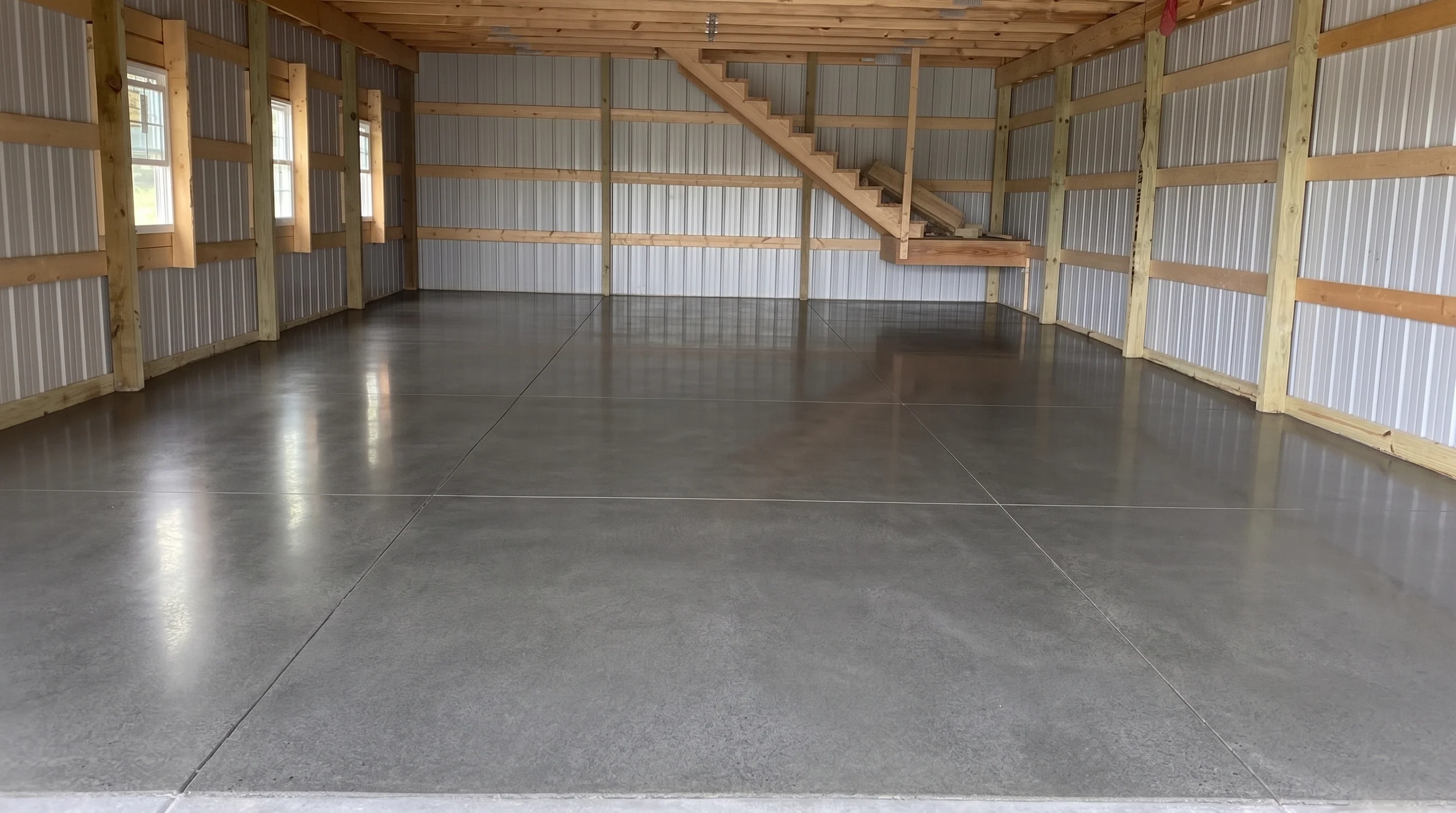 Custom concrete driveway and outdoor living space by Maxima Concrete in Ohio